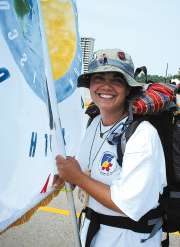 photo of Jillene Summers holding up World Youth Day banner of Diocese of Madison