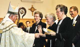 photo of Bishop Bullock greeting his sisters