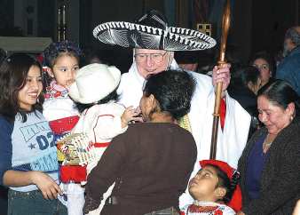 photo of Bishop Bullock wearing sombrero at end of Mass