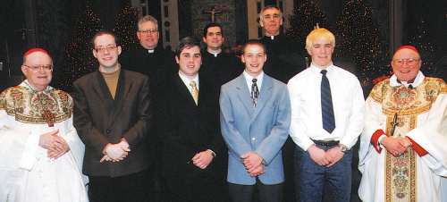 photo of Bishop Bullock, right, and Bishop Wirz with seminarians