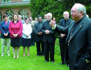 photo of Bishop Robert C. Morlino talking to diocesan staff