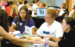 photo of teens praying together during recent Youth Engaging Scripture
