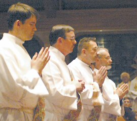 photo of (from left) ordinands Brian Dulli, Patrick Wendler, David Greenfield, and Lance Schneider