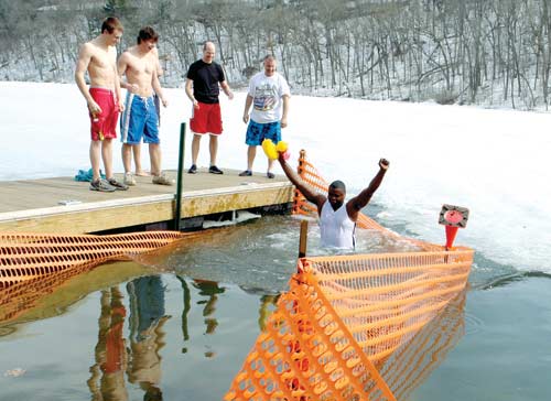 photo of Fr. Arinze jumping in lake